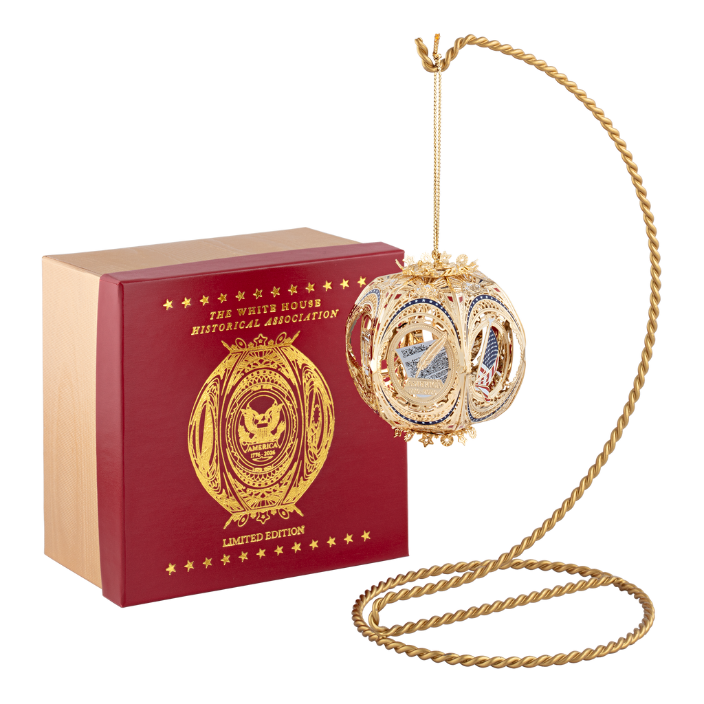 America's 250th Anniversary Story Ball Ornament hanging with gift box