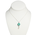 Necklace with a pendant on a white mannequin bust
